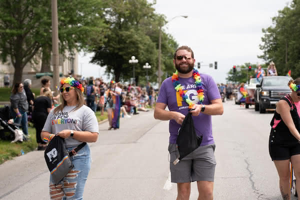 Dylan Lampe walking in the DSM Pride parade as part the F&G group.
